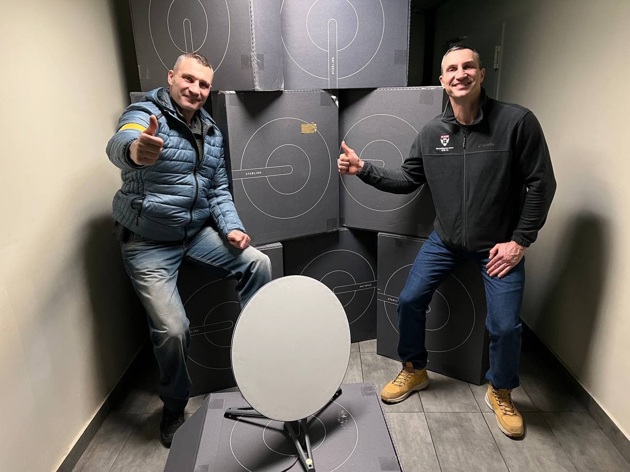 Vitali and Wladimir Klitschko with user terminal of Starlink system of satellite
